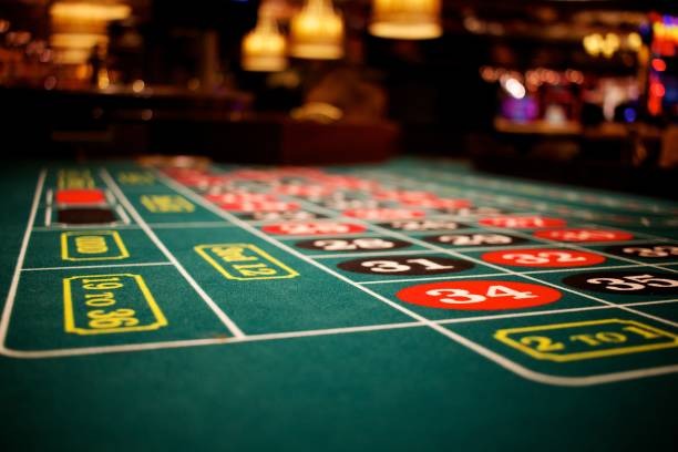 Live blackjack dealer at roulette platform studio, multiple camera angles visible